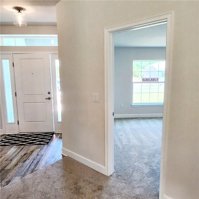 foyer featuring carpet