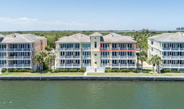 birds eye view of property with a water view