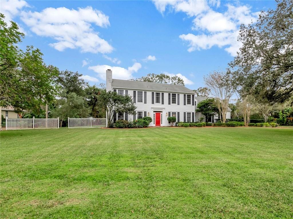 colonial home with a front yard