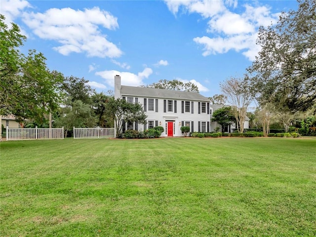 colonial home with a front yard