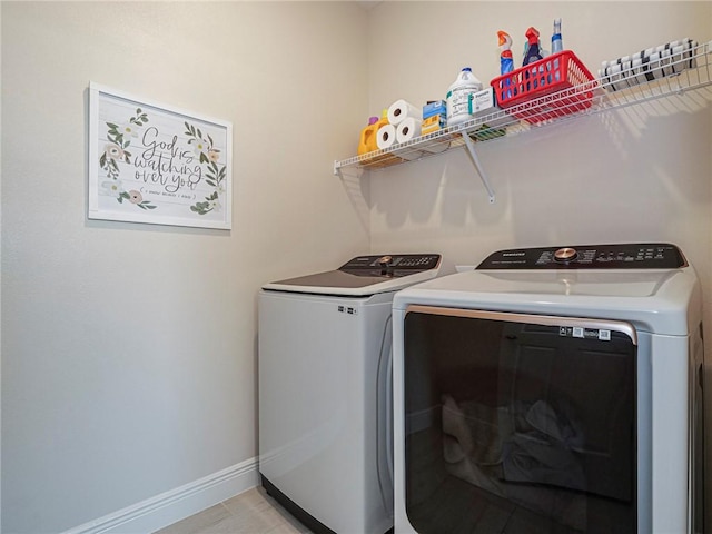 washroom with washing machine and dryer