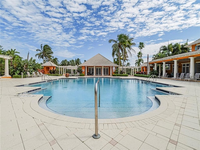 view of pool featuring a patio area and a pergola