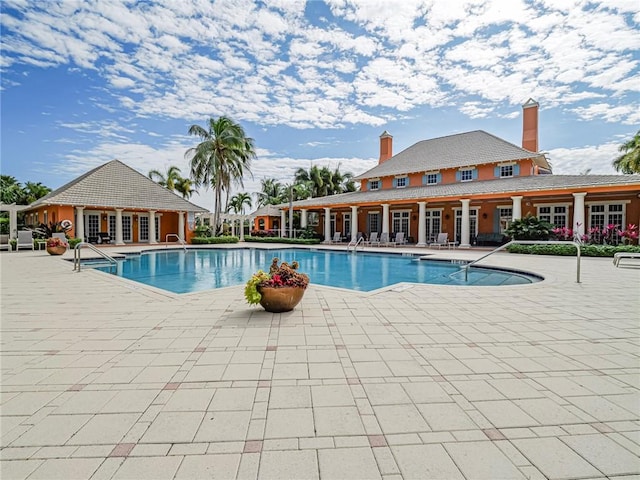 view of swimming pool featuring a patio area