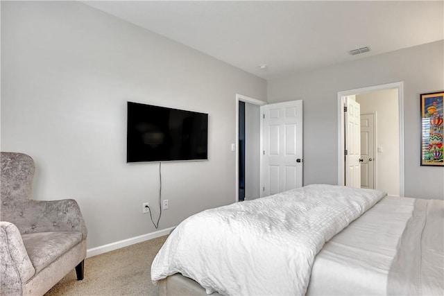 bedroom featuring light colored carpet