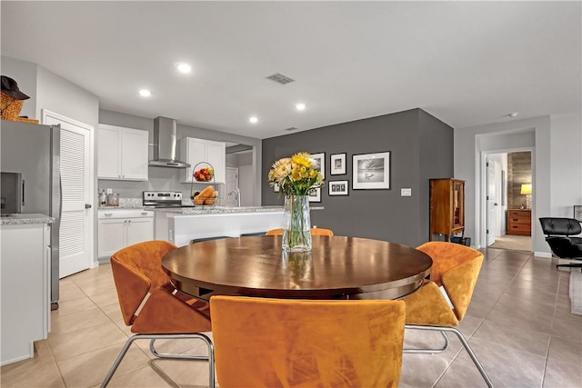 tiled dining space featuring sink