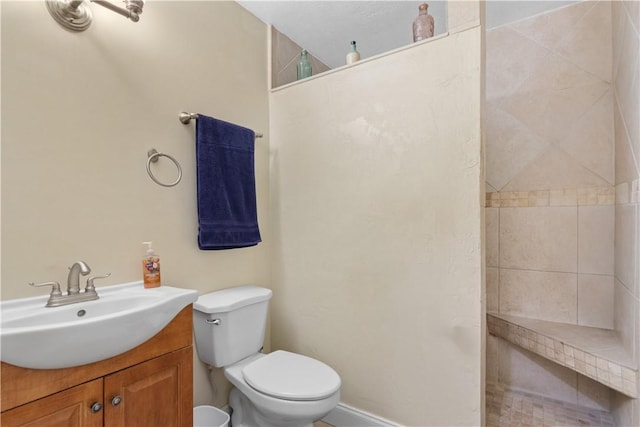 bathroom with toilet and vanity