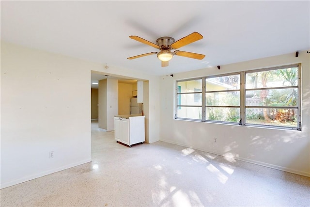 unfurnished room featuring ceiling fan