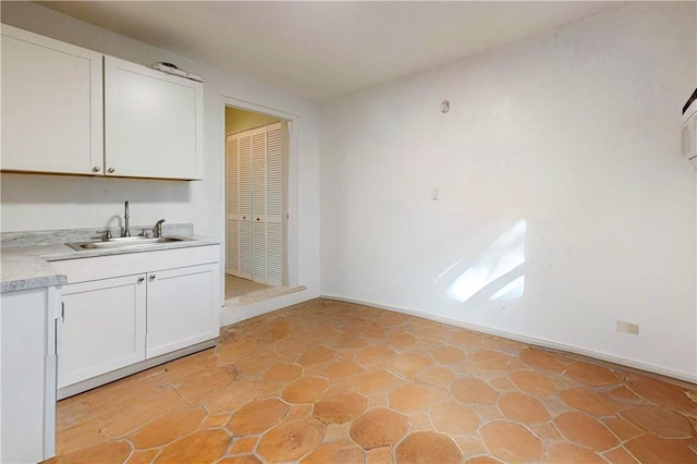 kitchen with sink and white cabinets