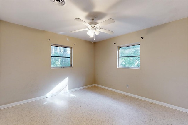 spare room featuring ceiling fan