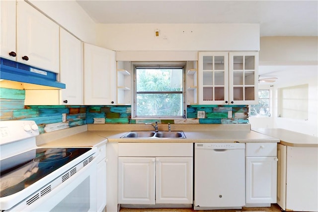 kitchen with white cabinetry, sink, and white appliances