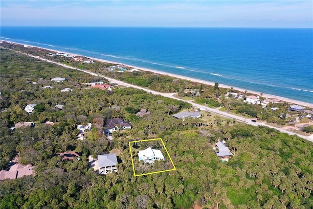 aerial view with a water view and a view of the beach