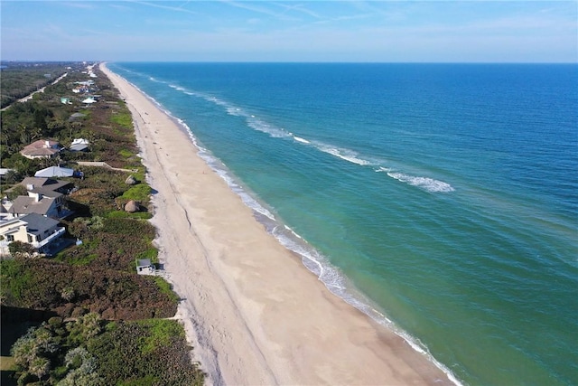 bird's eye view with a water view and a view of the beach