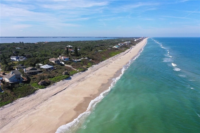 bird's eye view featuring a view of the beach and a water view