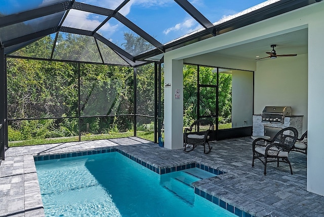 view of swimming pool featuring glass enclosure, ceiling fan, a patio, and a grill