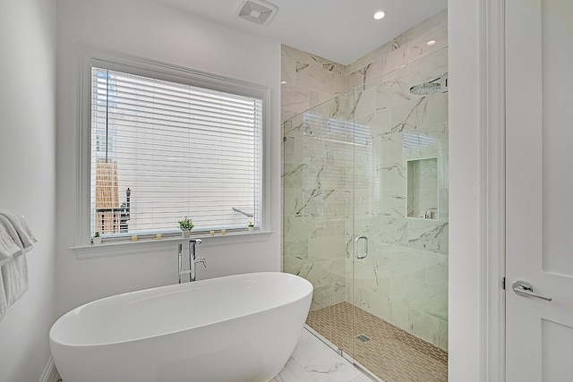 bathroom with shower with separate bathtub