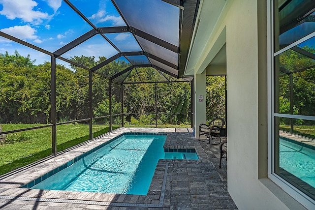 view of swimming pool featuring glass enclosure, a patio area, and a lawn