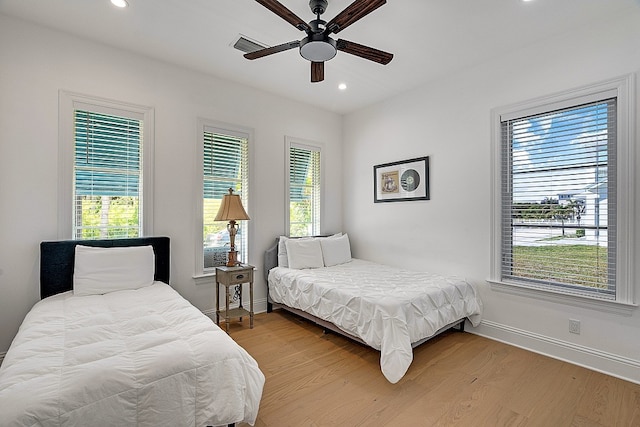 bedroom featuring hardwood / wood-style floors and ceiling fan