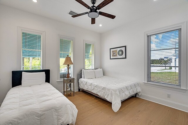 bedroom featuring hardwood / wood-style floors and ceiling fan