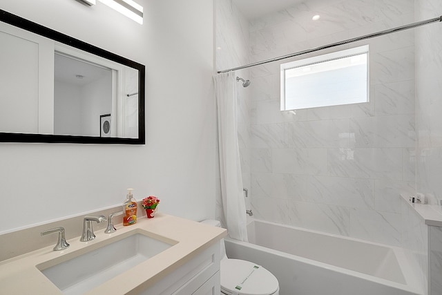 full bathroom featuring vanity, shower / bath combo with shower curtain, and toilet