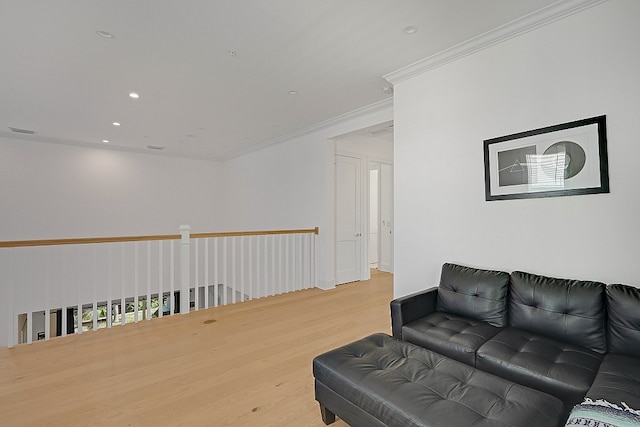 living room featuring hardwood / wood-style floors and ornamental molding