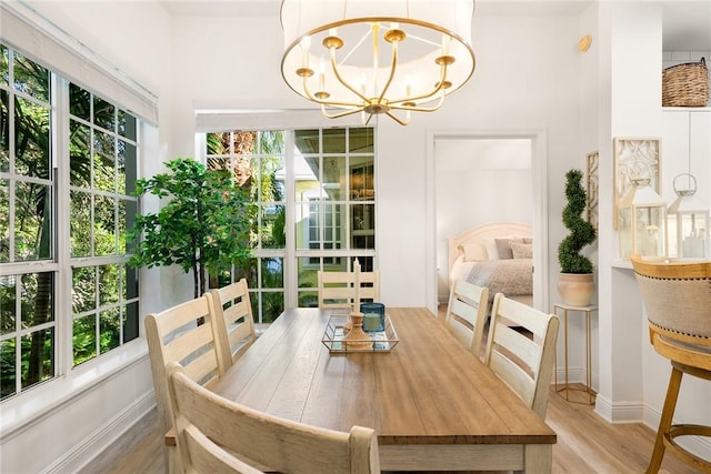 sunroom / solarium with an inviting chandelier and plenty of natural light