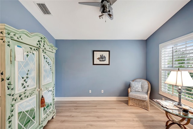 sitting room with light hardwood / wood-style floors, lofted ceiling, and ceiling fan