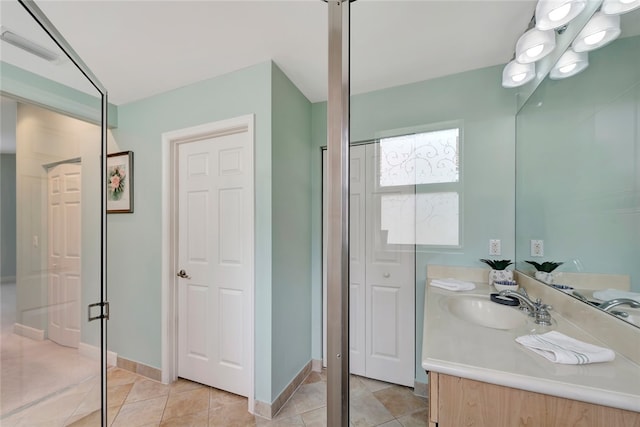 bathroom with vanity and tile patterned floors