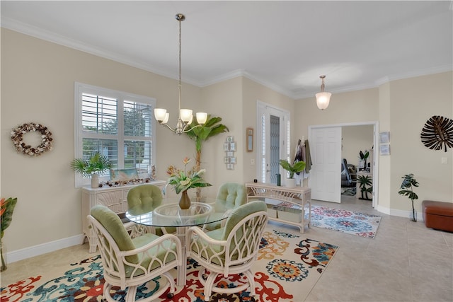 dining space featuring a chandelier, light tile patterned floors, and crown molding