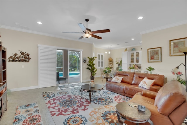 tiled living room with ceiling fan and crown molding