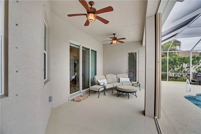 view of patio / terrace featuring a lanai and ceiling fan