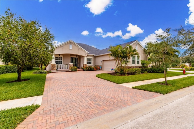 view of front of property with a front lawn and a garage