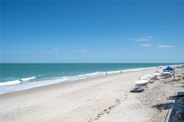 view of water feature with a beach view