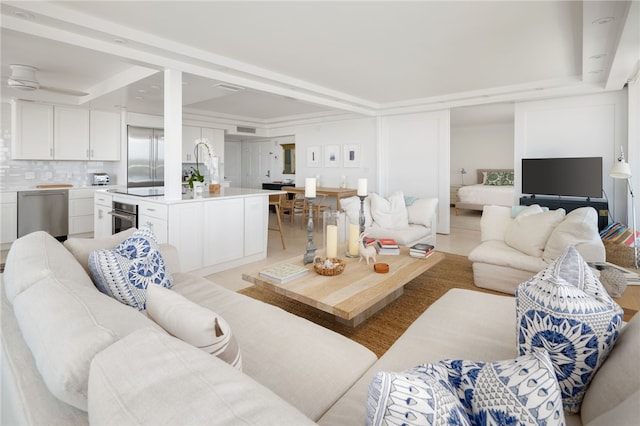 living room with ornamental molding