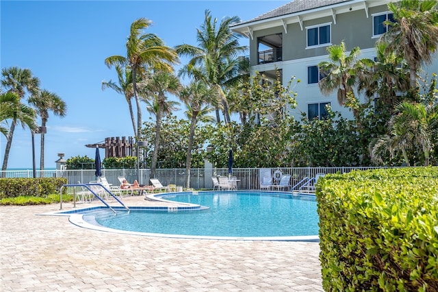 view of swimming pool featuring a patio area