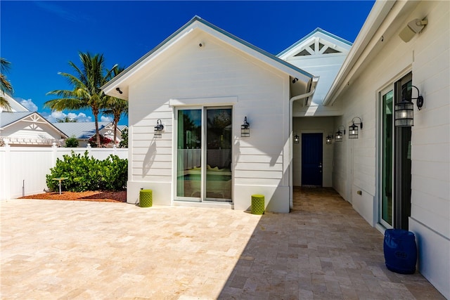 entrance to property featuring a patio area