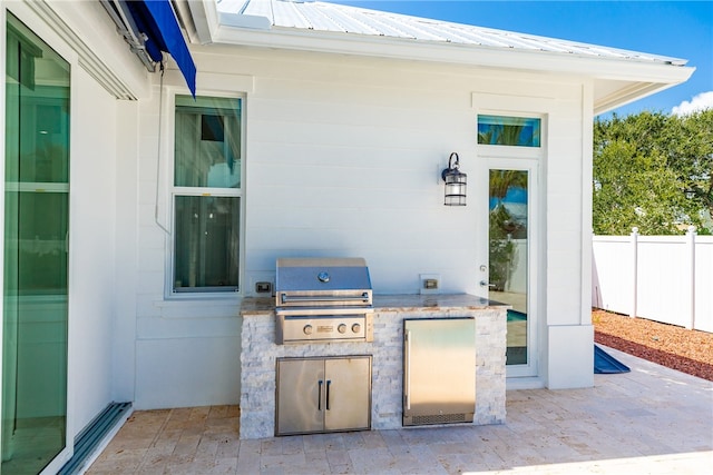 view of patio / terrace with exterior kitchen and area for grilling