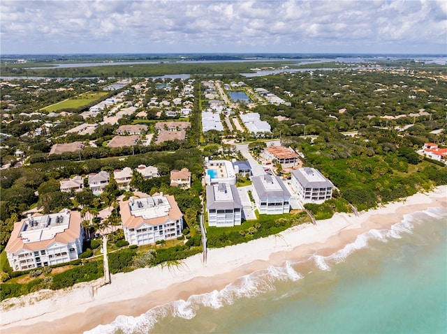 drone / aerial view with a water view and a beach view