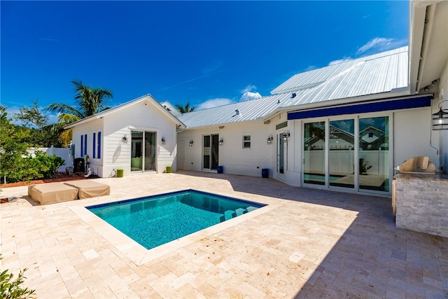 rear view of property featuring a patio area