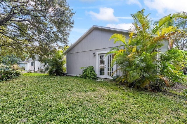 exterior space with a yard and french doors