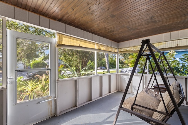 unfurnished sunroom featuring wooden ceiling