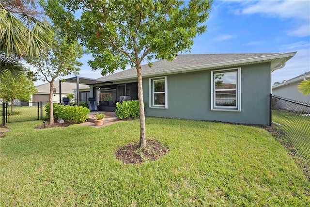 view of front of property with a front lawn and a sunroom