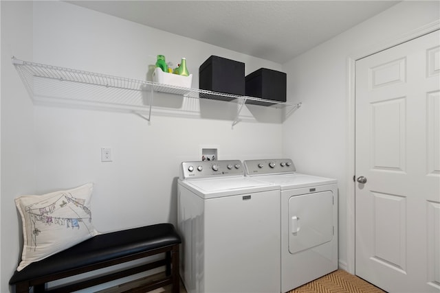 washroom featuring washer and dryer