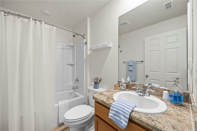 full bathroom with wood-type flooring, toilet, a textured ceiling, vanity, and shower / bathtub combination with curtain