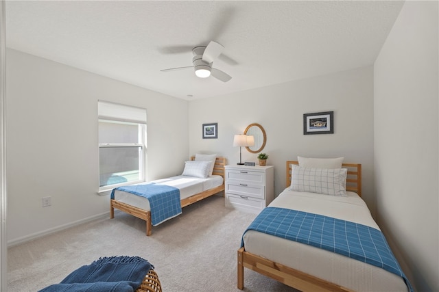 bedroom with light colored carpet and ceiling fan