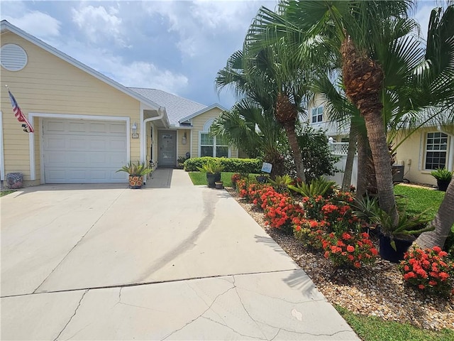 495 9th Pl, Vero Beach, FL 32960 - view of front of home featuring concrete driveway and a garage