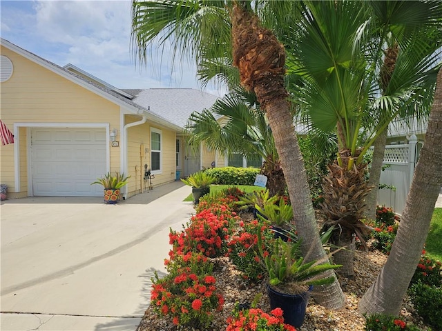 495 9th Pl, Vero Beach, FL 32960 - view of front of home featuring driveway, a garage, and a shingled roof