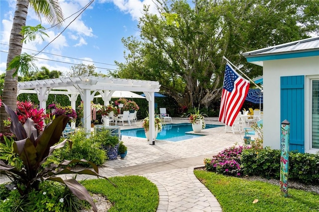 view of pool with a pergola and a patio area