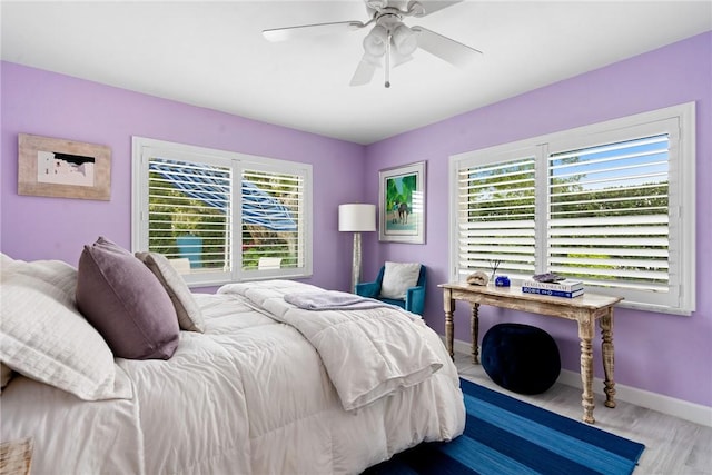 bedroom with hardwood / wood-style flooring and ceiling fan