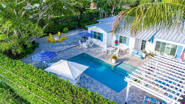 view of swimming pool with a patio area