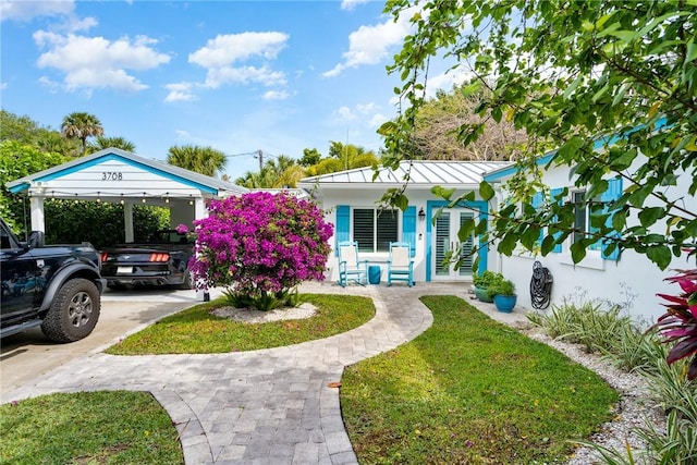 bungalow-style home featuring a porch and a front yard